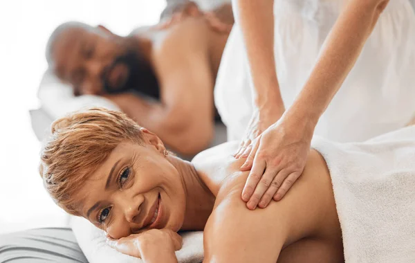 Spa, relax and massage therapy for black couple on vacation in hotel resort. Wellness, body care and relaxing treatment, health and luxury massaging of happy mature man and woman on holiday together