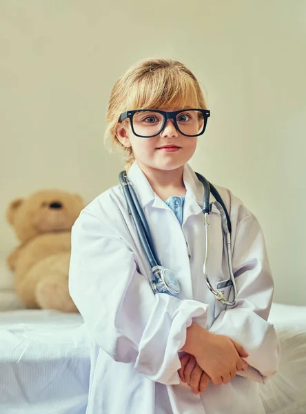 Watch me get the nobel prize in medicine. Portrait of an adorable little girl dressed up as a doctor and showing a thumbs up gesture