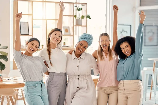 Empowerment, success and portrait of group of women celebrating achievement, win and victory in startup. Teamwork, diversity and businesswomen in celebration with hands in air in creative workspace.