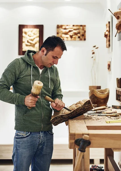 stock image Traditional art is the perfect antidote for stress. an artist carving something out of wood