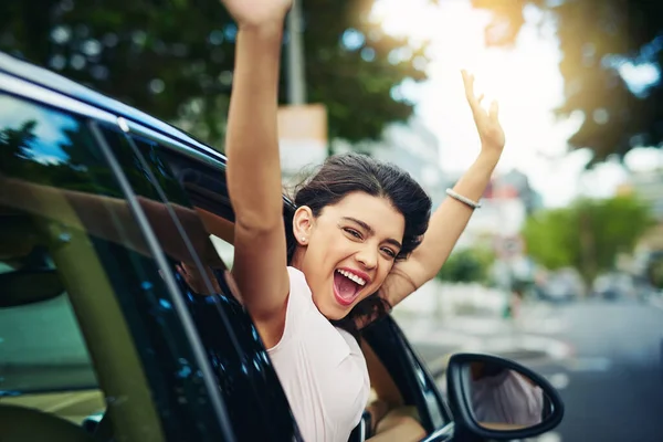 stock image Having your own car is the ultimate freedom. an attractive young woman celebrating her new car