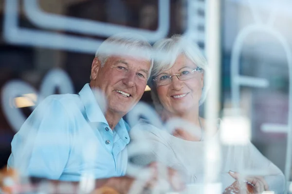 stock image We make a point to date each other. Cropped portrait of an affectionate senior couple in their local coffee shop