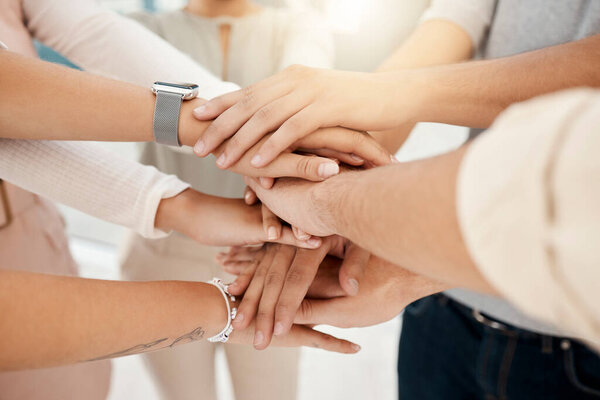 Stacked hands, team building and employee teamwork with business community support, collaboration and motivation together. Corporate unity, staff solidarity and creative startup workforce cooperation.
