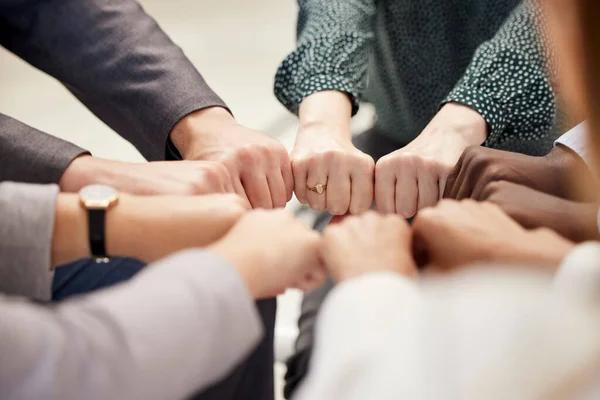 Fist bump, office teamwork and diversity of hands together for business and team support. Team building, community and collaboration success hand sign of company worker staff group about to work.