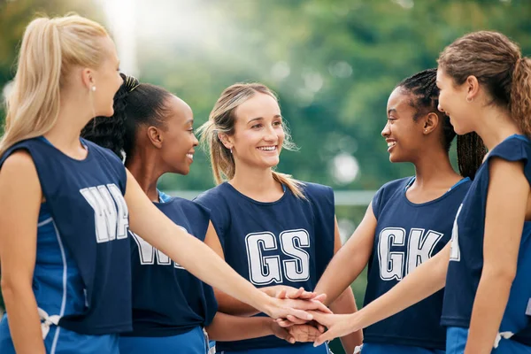 Netball team, hands and women sports motivation of athlete group showing happy teamwork support. Female exercise group with diversity and smile ready for a training match outdoor with happiness.