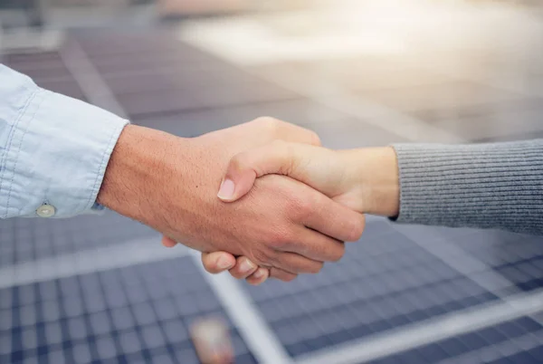 stock image Handshake, welcome and b2b with a business man and woman shaking hands at a solar power plant. Meeting, thank you and collaboration with an employee team in agreement in the energy supply industry.
