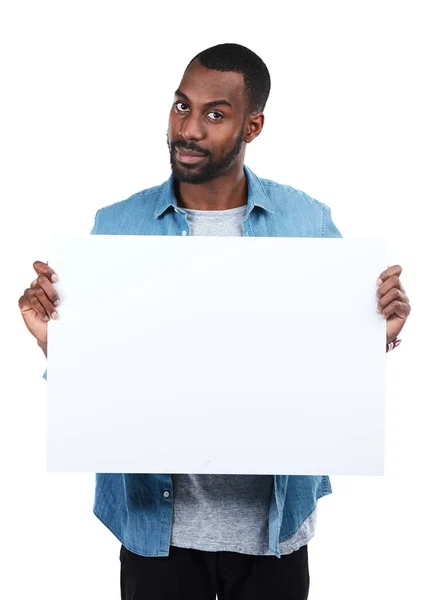 Stock image Trust me, its the one you want. Cropped portrait of a young man holding an empty sign against a white background