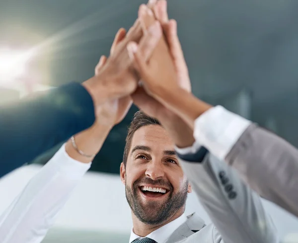stock image We stand together to make big changes. motivated work colleagues smiling and celebrating with a high five
