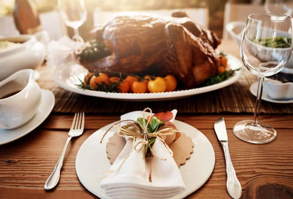No feast is complete without the turkey. a roast turkey on a dining table on Thanksgiving