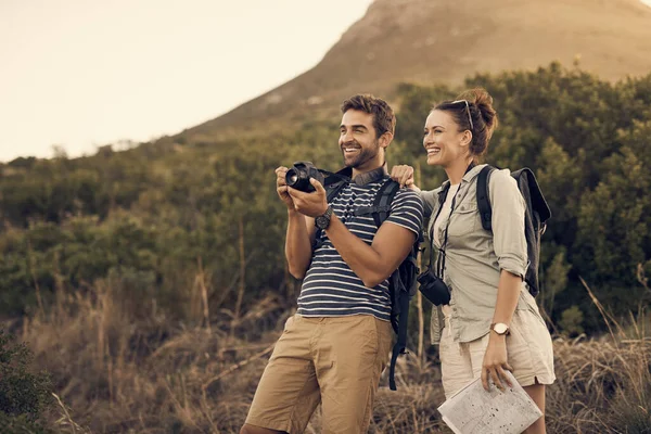 stock image Date someone who shares the same interests. a couple taking pictures on their camera while out hiking