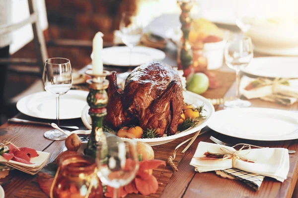 Where theres roast, theres guests. a dining table with food on it