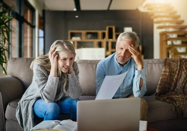 stock image Will we ever see the end of all these bills. a couple looking anxious while doing their budget at home