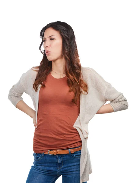 stock image That doesnt feel good. a young woman experiencing lower back pain in studio