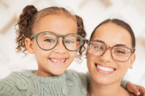 Woman with glasses, eye care for child and frame lens with happy girl face or optician vision for sight. Family portrait with mother, advertising optometrist spectacles deal and eyes looking together.