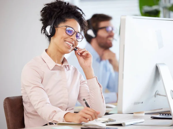 Call center, black woman and customer service on computer, consulting agency and contact us, help and telemarketing company at office desk. Happy consultant, sales worker and business communication.