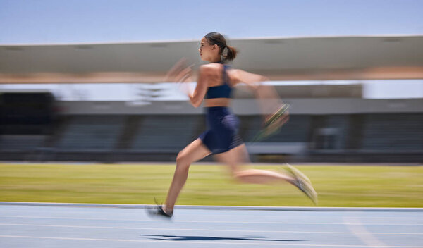 Woman, motion blur or running on stadium track in fitness training, workout or exercise for race, marathon or competition challenge. Runner, sports athlete or fast movement and speed in energy cardio.