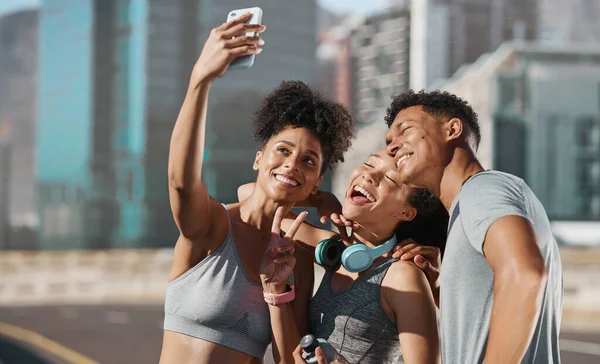 Fitness, city friends and phone selfie, motivation for training with happy runner friend or personal trainer. Urban workout, running club and fun photo with smile on smartphone after healthy exercise.