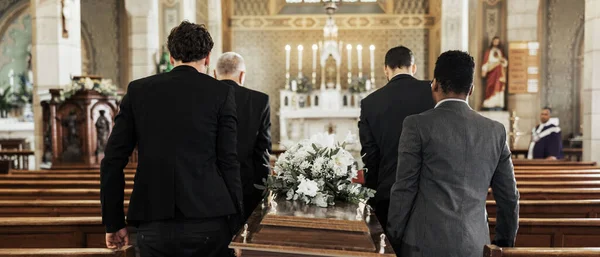 Funeral, church and group carry coffin in service, death or sermon for burial with support. Friends, family or pallbearers with casket for respect, help or sorrow in mourning, worship or god religion.