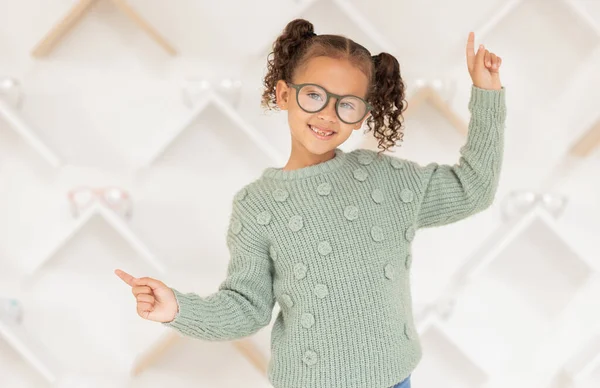 Child, glasses and eye care vision support for medical healthcare. Portrait of young girl, happy and healthy eye exam success or lens wellness treatment in optometrist eye clinic, surgery or store.