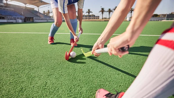Sports game, field hockey and women challenge for ball in dynamic club competition, workout performance or practice match. Fitness exercise, training action and athlete battle tackle on stadium turf.