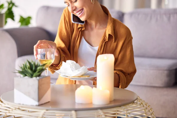 Woman, candles and phone call with smile, happy and content being peaceful, relax or in living room. Female, light and smartphone for conversation, champagne and talking for joy or cheerful in lounge.