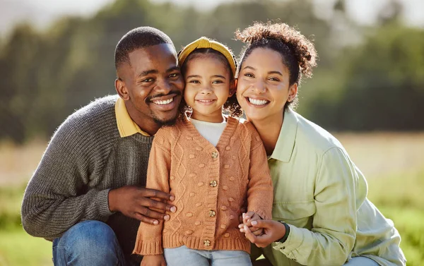 Black family, child and bonding in nature park, sustainability garden environment and countryside grass field in trust, love and support. Portrait, smile and happy black woman, man and girl in summer.