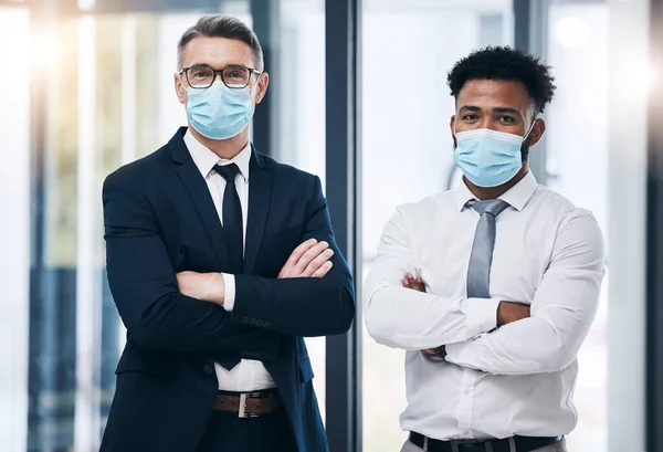 Covid, face mask and businessman people in office portrait for compliance, company policy and risk management teamwork. Proud, diversity and leadership corporate men for corona virus healthcare rules.