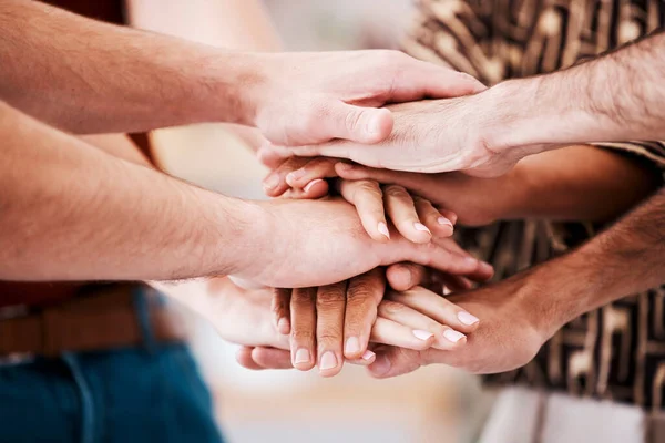 Hands, team building and employee teamwork with business community support, diversity collaboration or motivation together. Corporate unity, staff solidarity or creative startup workforce cooperation.