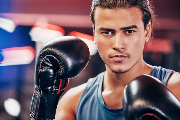 Boxing, boxer and man with fitness boxing gloves in portrait, sport training and motivation for healthy life. Athlete, martial arts or mma fighter with exercise and workout, wellness and cardio