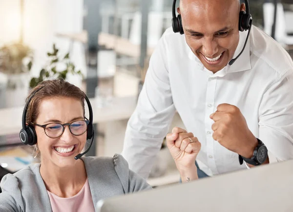 Call center, celebration and team happy about success, target and sales of a consultant in training with her mentor, coach or manager. Man and woman in telemarketing, CRM and customer service office.