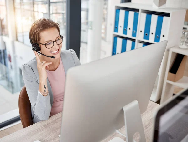 stock image Call center, customer service and consultant with a business woman at work on a computer in her office. Contact us, crm and telemarketing with a female consulting using a headset for sales or support.