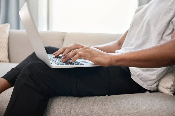 Stock image Laptop, home and hands of black man typing email, social media content writing article or contact social network blog user. Person review online survey data, feedback or working on seo copywriting.