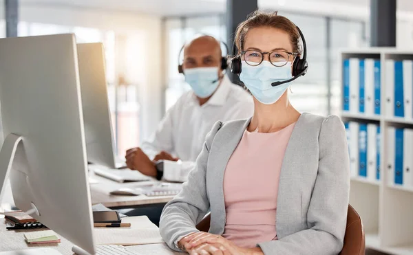 Covid, call center and portrait in office with medical mask for safety, health and protection from virus at pc. Consultant, telemarketing and workplace people with corona face mask at computer