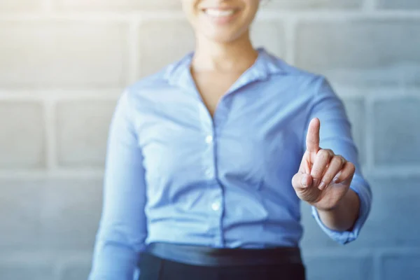 stock image Shes ready for the office of the future. an unidentifiable businesswoman pretending to touch a touchscreen while standing in the office