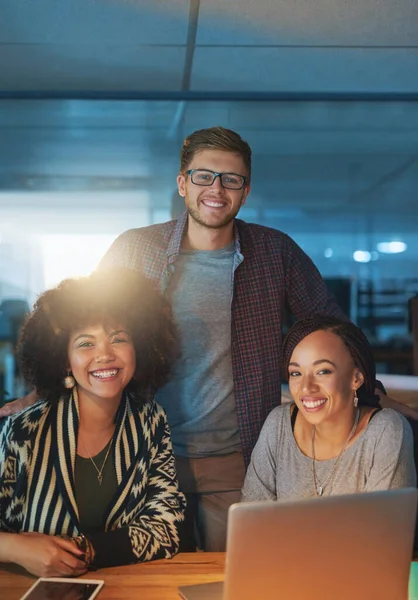 stock image We never miss a deadline. Cropped portrait of a group of young people working late in the office