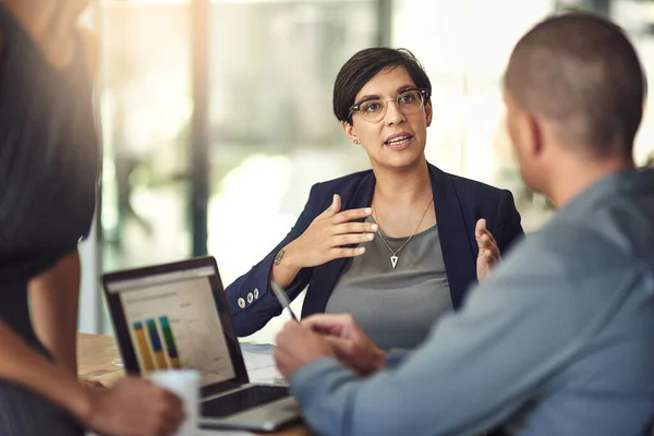 stock image Every accomplishment starts with the decision to try. colleagues having a discussion in a boardroom