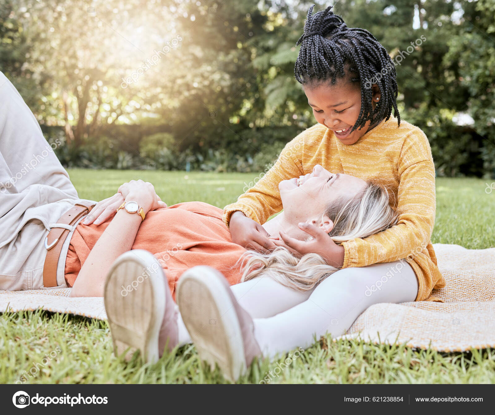 Mother Picnic Happy Child Interracial Family Smile Floor Hug Happiness Stock Photo by ©PeopleImages 621238854