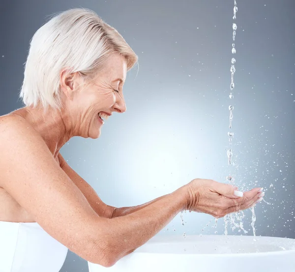 Senior Woman Water Splash Cleaning Hands Basin Hygiene Grey Studio — Stock Photo, Image