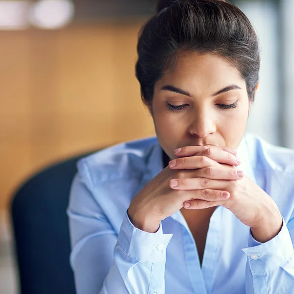 stock image Works getting her down. a young businesswoman looking stressed at the office