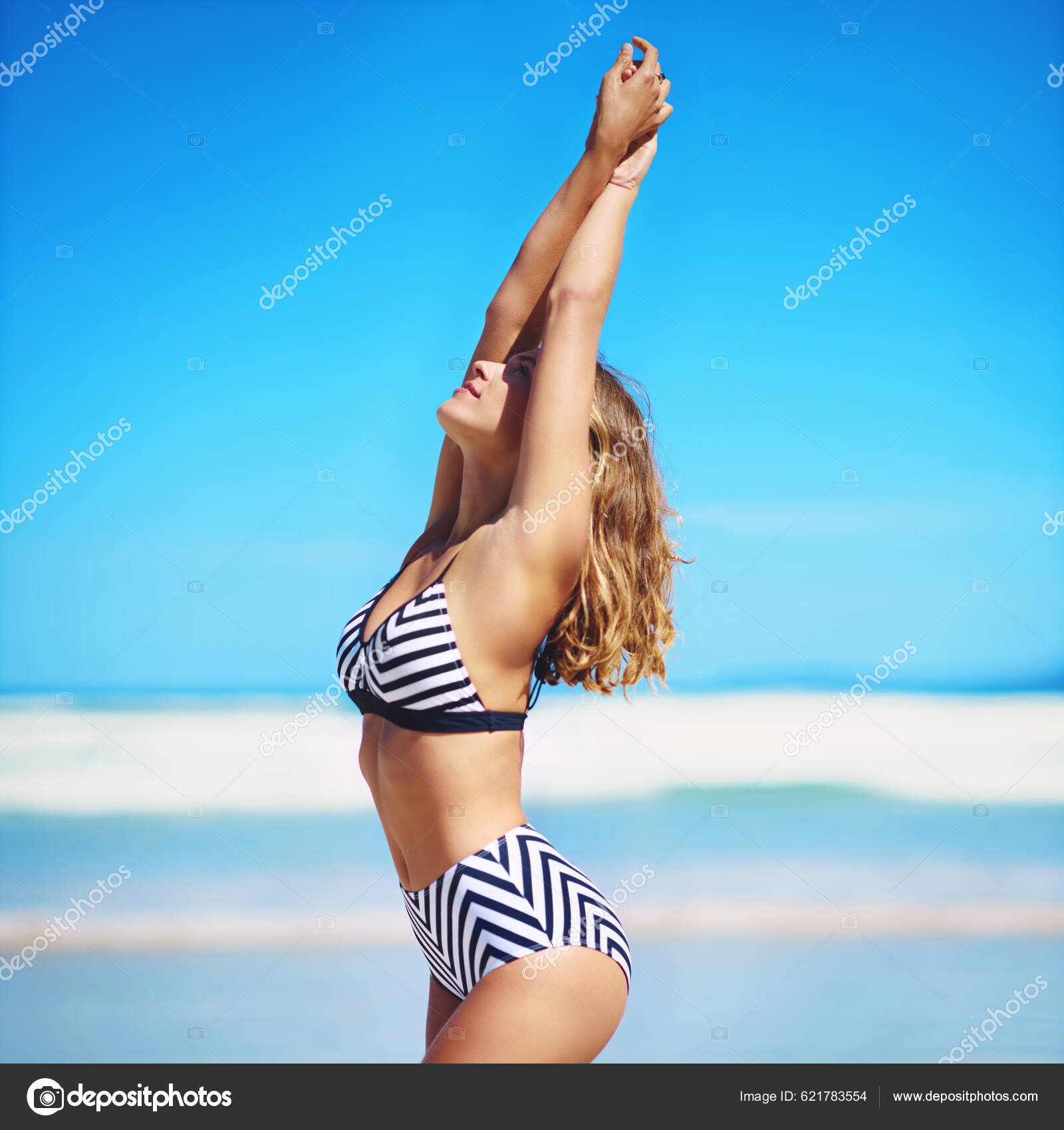 Feeling Free Summer Young Woman Posing Her Bikini Stock Photo by  ©PeopleImages.com 621783554
