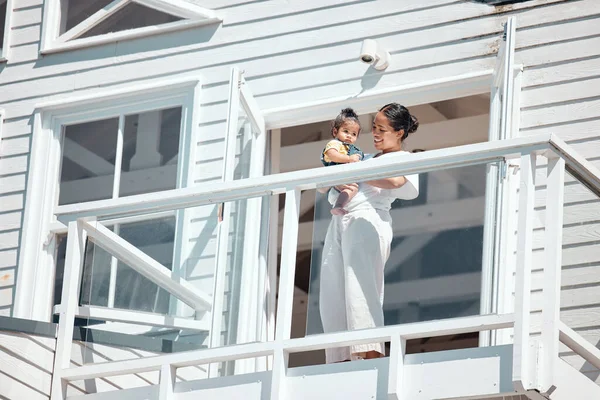 Balcony, holiday and family or mother with baby for summer, wealth and real estate happiness, investment or house outdoor. Happy, care and mom with child together for vacation home, villa or property.