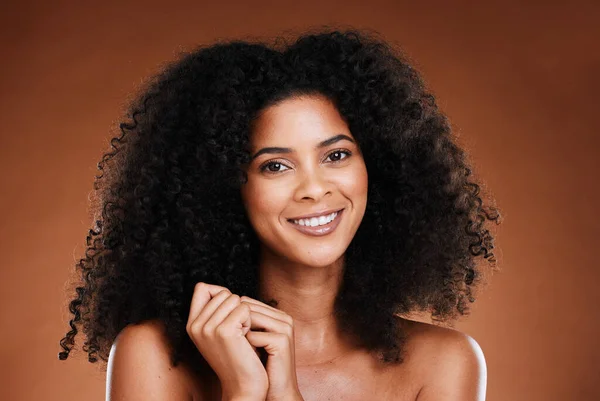 Hair care, natural and black woman in portrait for salon, beauty and wellness with healthy glow in studio. Skincare, hair growth results and happy young model in headshot or face for self love luxury.