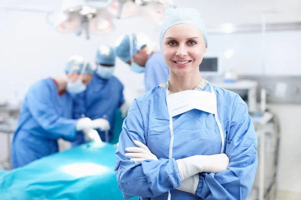 I love this job. Portrait of a happy female surgeon smiling in an operating theatre - Copyspace