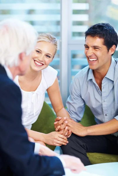 stock image Couple with financial advisor. Portrait of young couple having good time with financial advisor