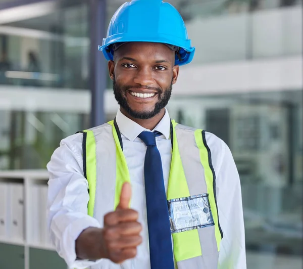 Portrait, black man and engineer thumbs up for success, approval or support for construction or building project. Thank you, yes or happy architect, construction worker or contractor in safety helmet.
