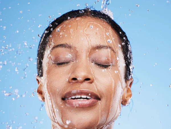 Face cleaning, water and black woman with shower for body hygiene health, self care routine or facial bathroom treatment. Water drop, wellness and relax model with water splash for skincare wellness.