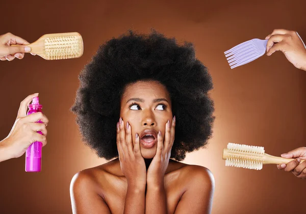 Black woman thinking of hair care, tools for natural afro and decision making of beauty products. Shocked african girl with choices, salon brushes and hairspray in studio with dark brown background.
