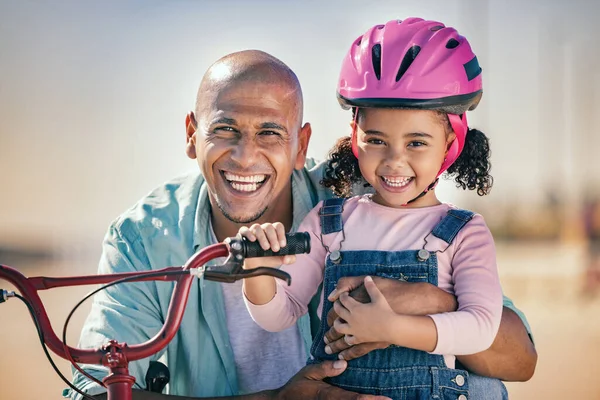 Summer, father and portrait of family with bike in sunshine for bond, wellness and happiness. Black family, care and smile of happy dad teaching young and cute daughter bicycle riding lesson