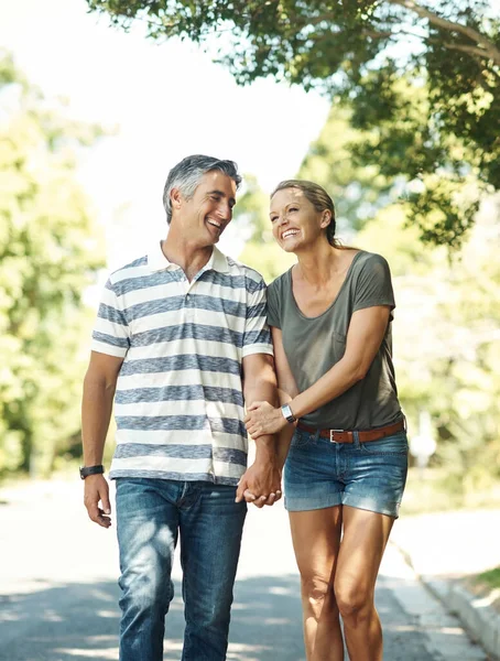 stock image They always know how to make each other smile. an affectionate mature couple enjoying a day in the park