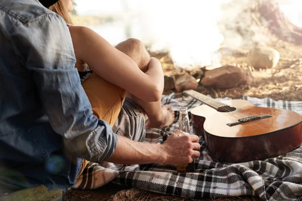 stock image Taking life easy...a couple lying on a blanket next to a guitar